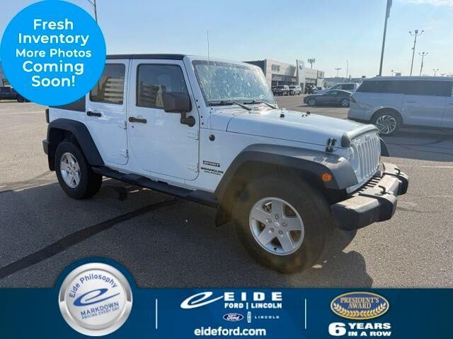 2012 Jeep Wrangler Unlimited Sport — photo 1 of 26
