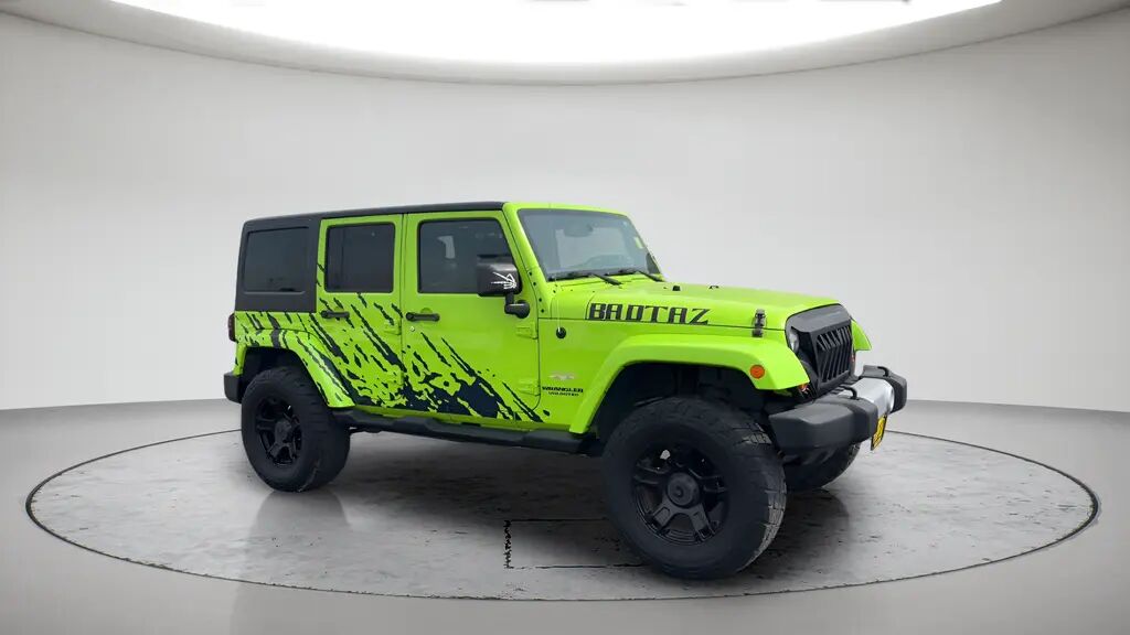 2013 Jeep Wrangler Unlimited Sahara — photo 1 of 12