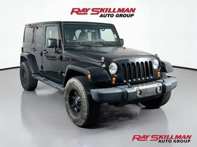 2011 Jeep Wrangler Unlimited Sport Mojave — photo 1 of 12