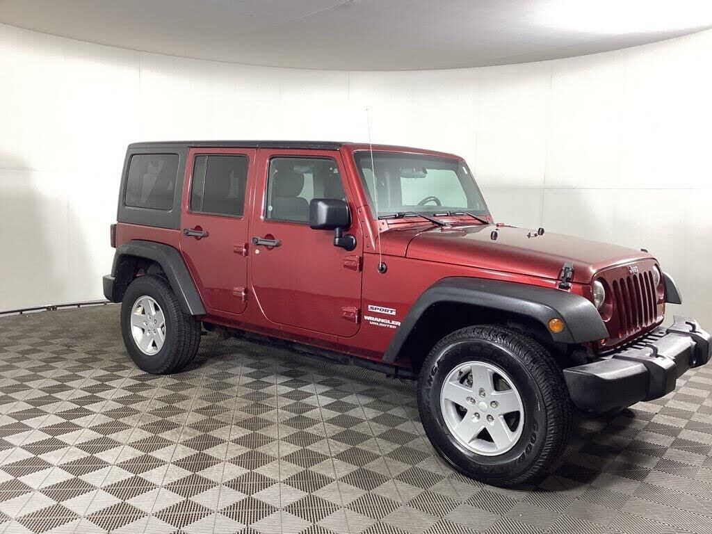 2011 Jeep Wrangler Unlimited Sport Mojave — photo 1 of 28