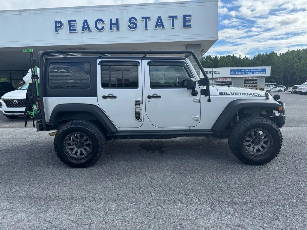 2011 Jeep Wrangler Unlimited Sport — photo 1 of 14