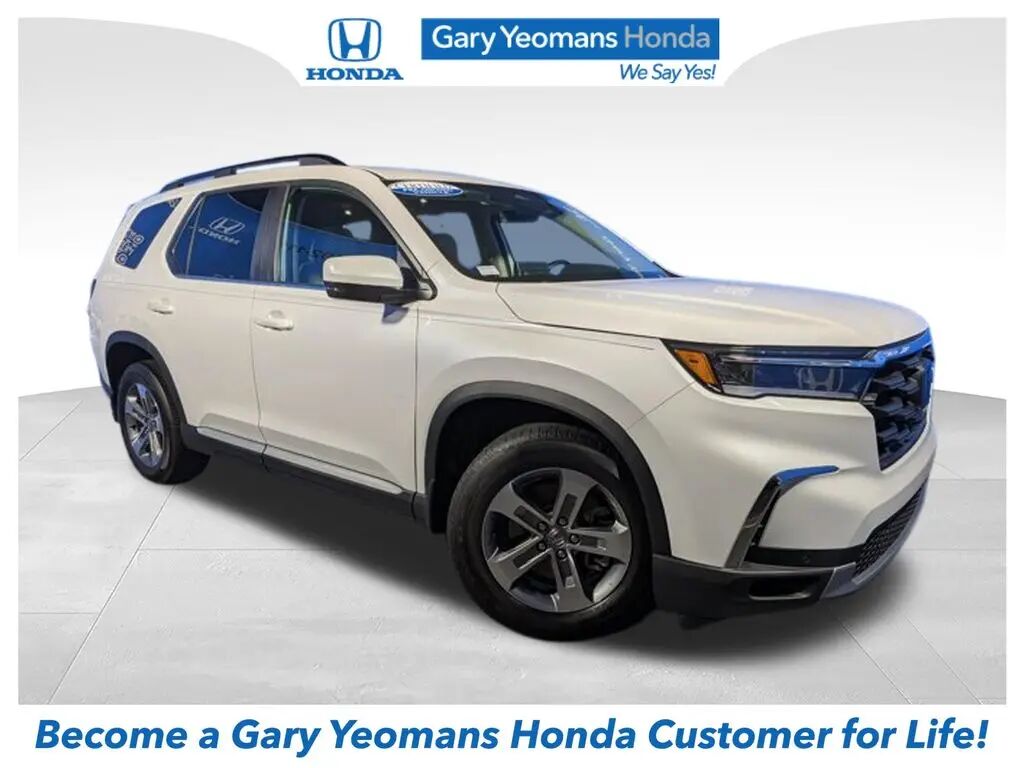 2023 Honda Pilot EX-L w/Rear Captain's Chairs — photo 1 of 13