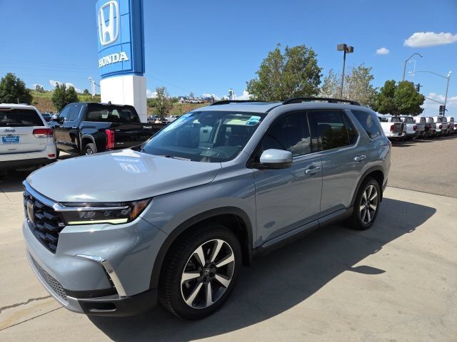 2023 Honda Pilot AWD ELITE — photo 1 of 7